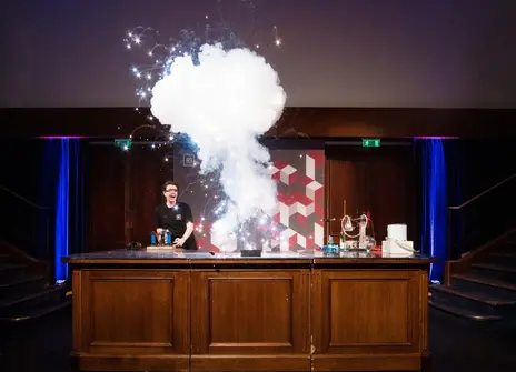 Ri member of staff explodes a sparkly pyrotechnic