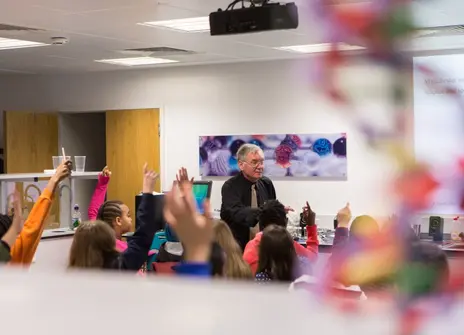 Children and a teacher in a classroom