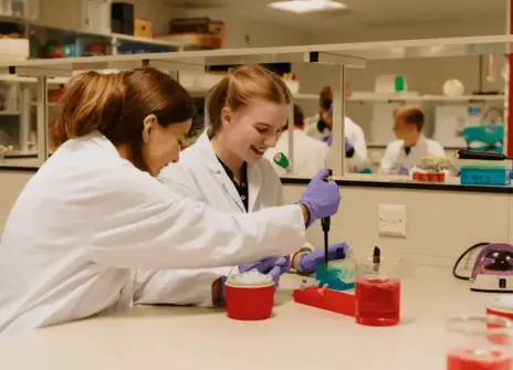 Two students using a micropipette 