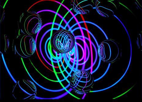 Abstract picture involving clear spheres intersected by lots of different coloured curvy lines. 