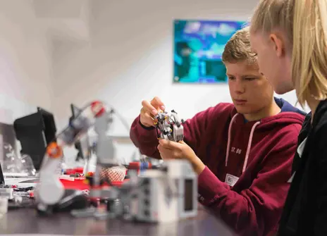 Participants working on a robotics project at a workshop