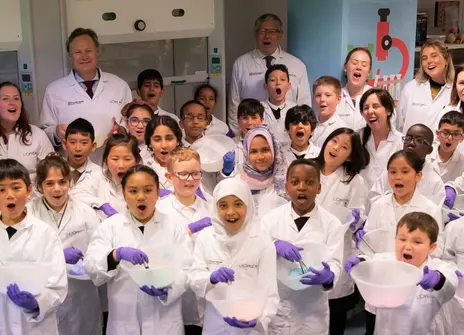 Children in lab coats in the Young Scientist Centre