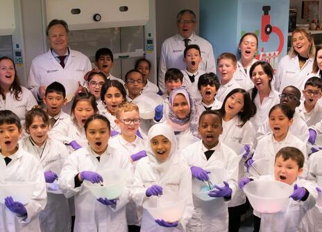 Children in lab coats in the Young Scientist Centre