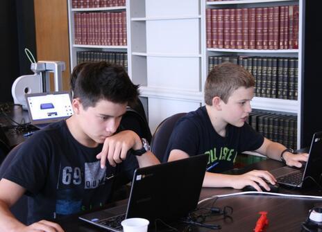 Students working on laptop computers