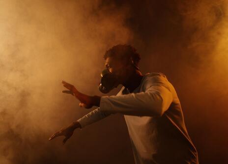 A man wears a mask in smog