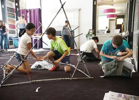 Participants building STIXX shelters