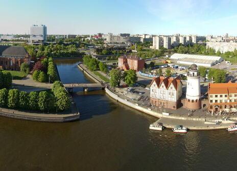 aerial view of the town of Konigsberg with a river bending around some trees and medieval looking buildings